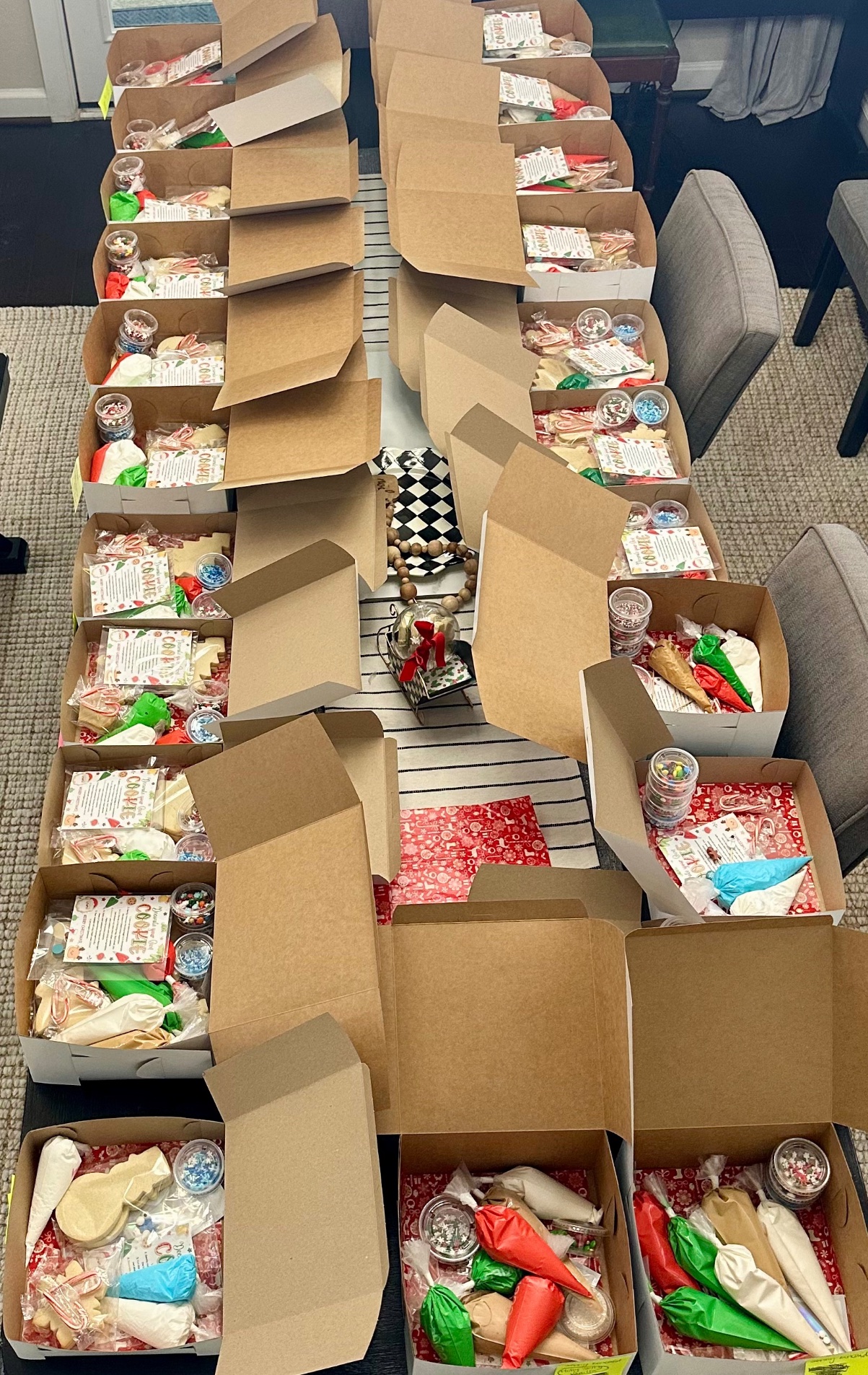 Christmas DIY cookie kits lined up during packing day