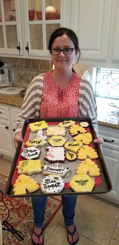 You holding the tray: Kathy holding a full tray of her first bee themed decorated cookies in her friends home kitchen