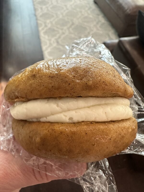 Pumpkin whoopie pie with cream cheese icing filling