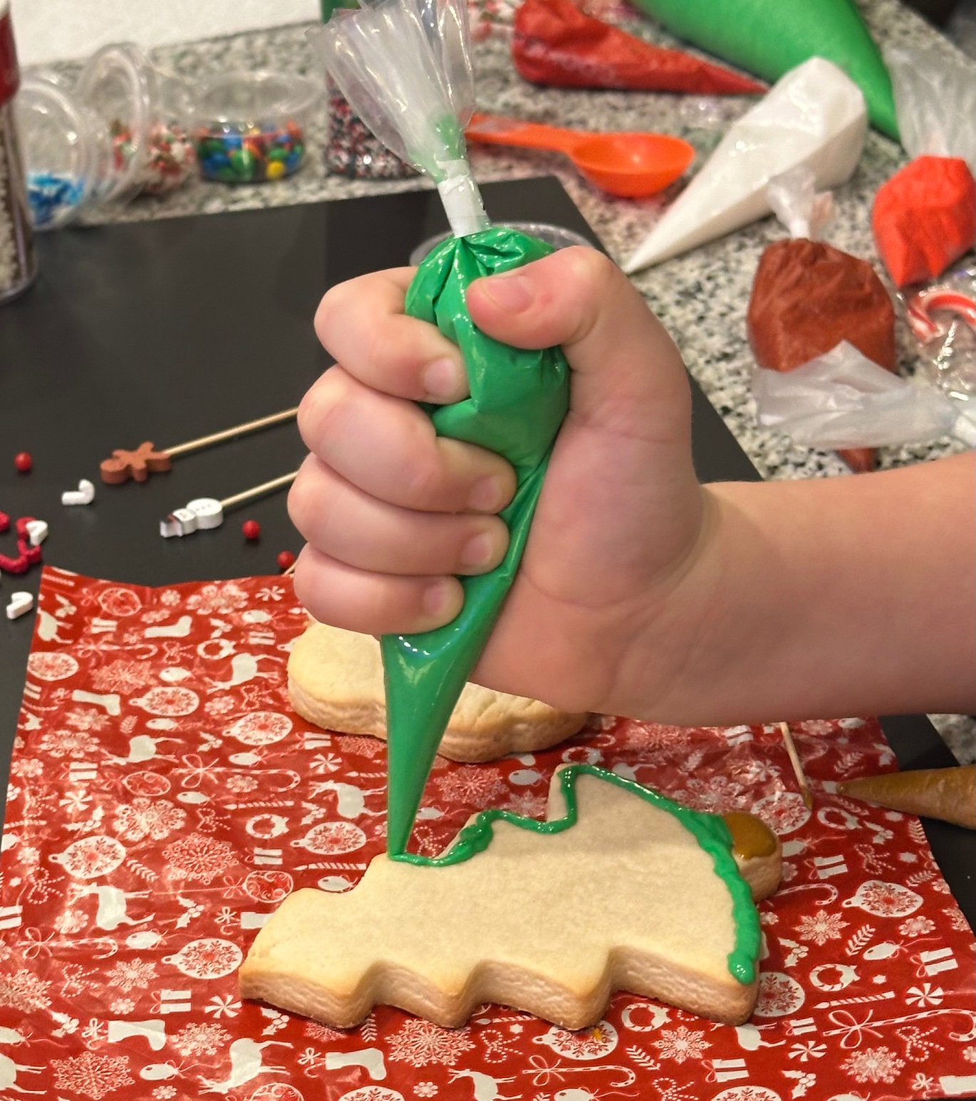 Child squeezing a heat-sealed icing bag — the seal holds tight