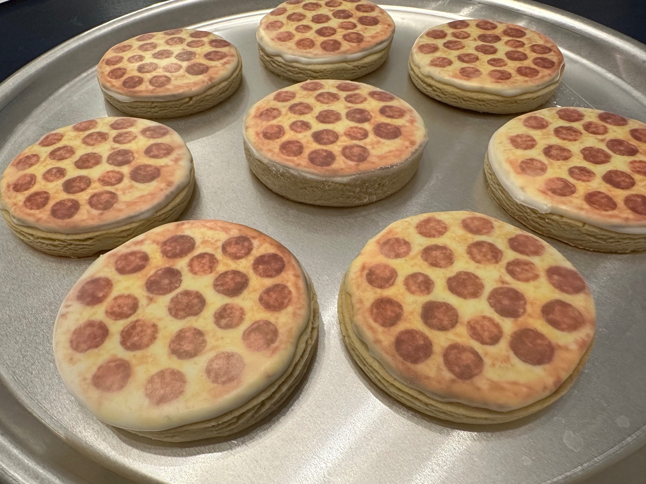 Tray of pizza cookies printed with edible ink