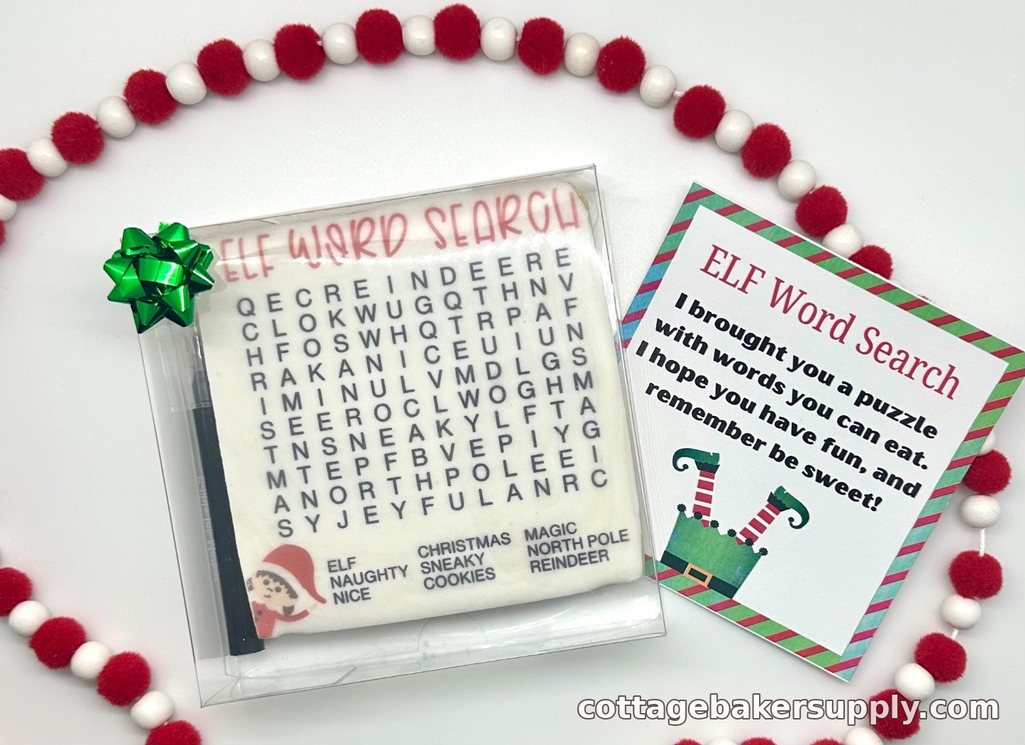 Word search cookie and edible marker gift-boxed in a clear box with a Christmas bow