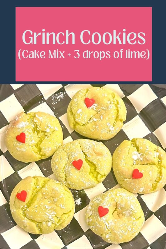 A stack of finished holiday Grinch cake mix crinkle cookies topped with red candy heart sprinkles, presented on a black and white checkered MacKenzie-Childs platter.