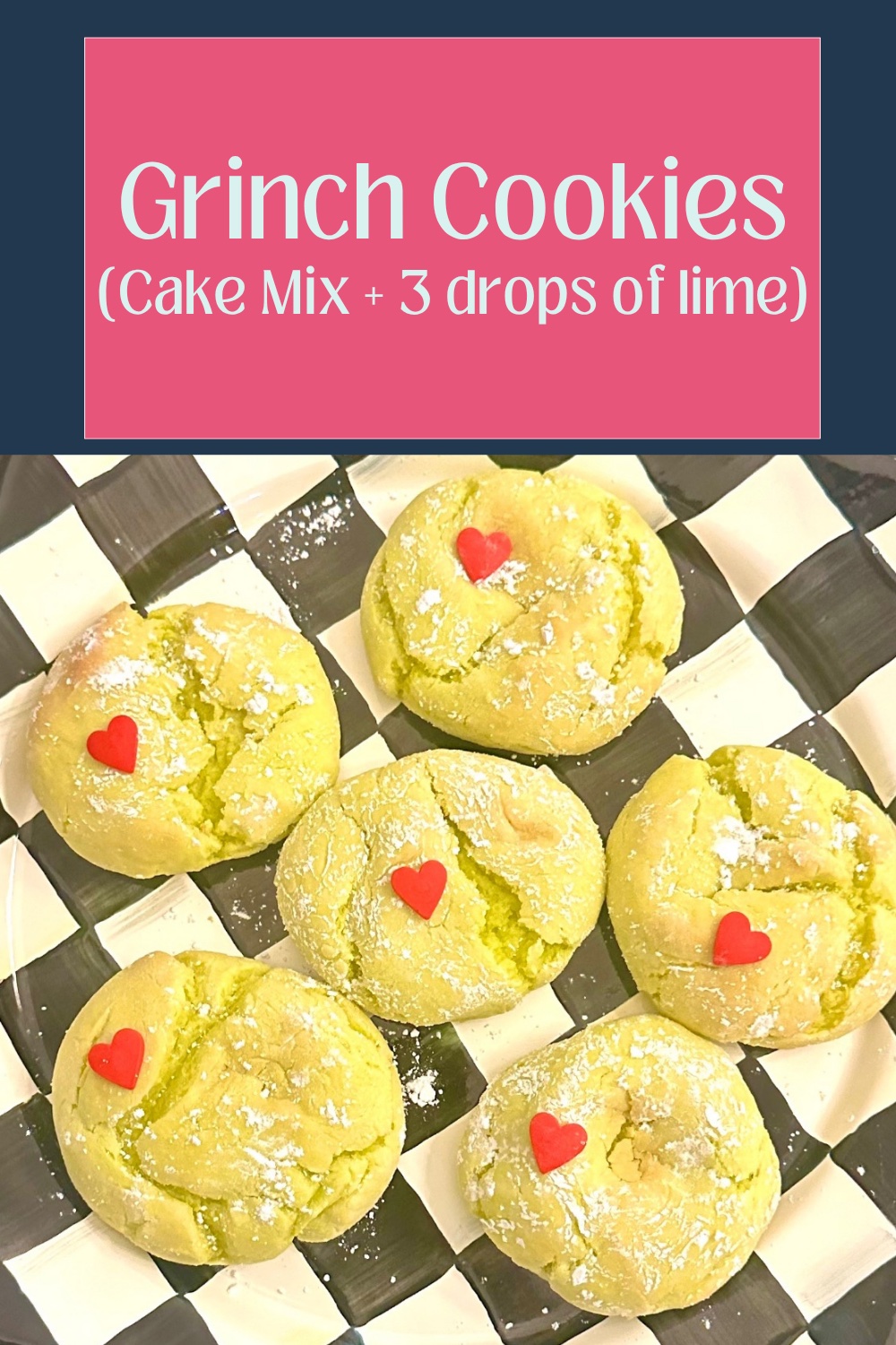 A stack of finished holiday Grinch cake mix crinkle cookies topped with red candy heart sprinkles, presented on a black and white checkered MacKenzie-Childs platter.