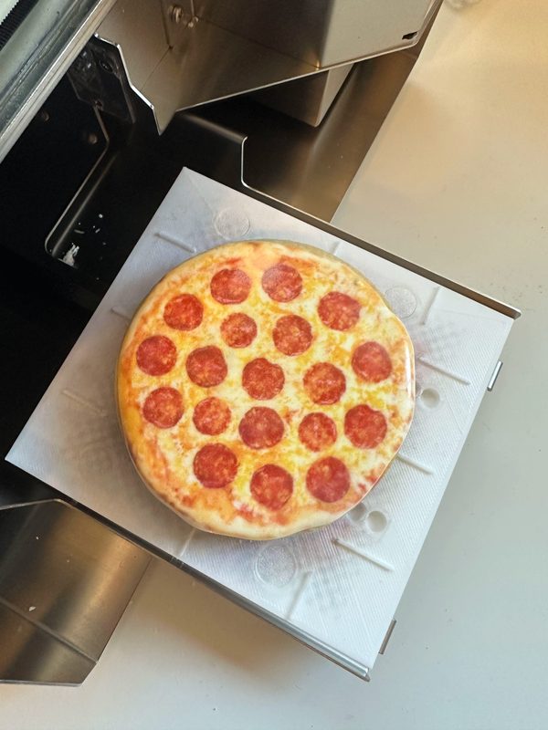 Elf pizza cookie printed on the Eddie edible printer — a round sugar cookie printed to look like a pepperoni pizza